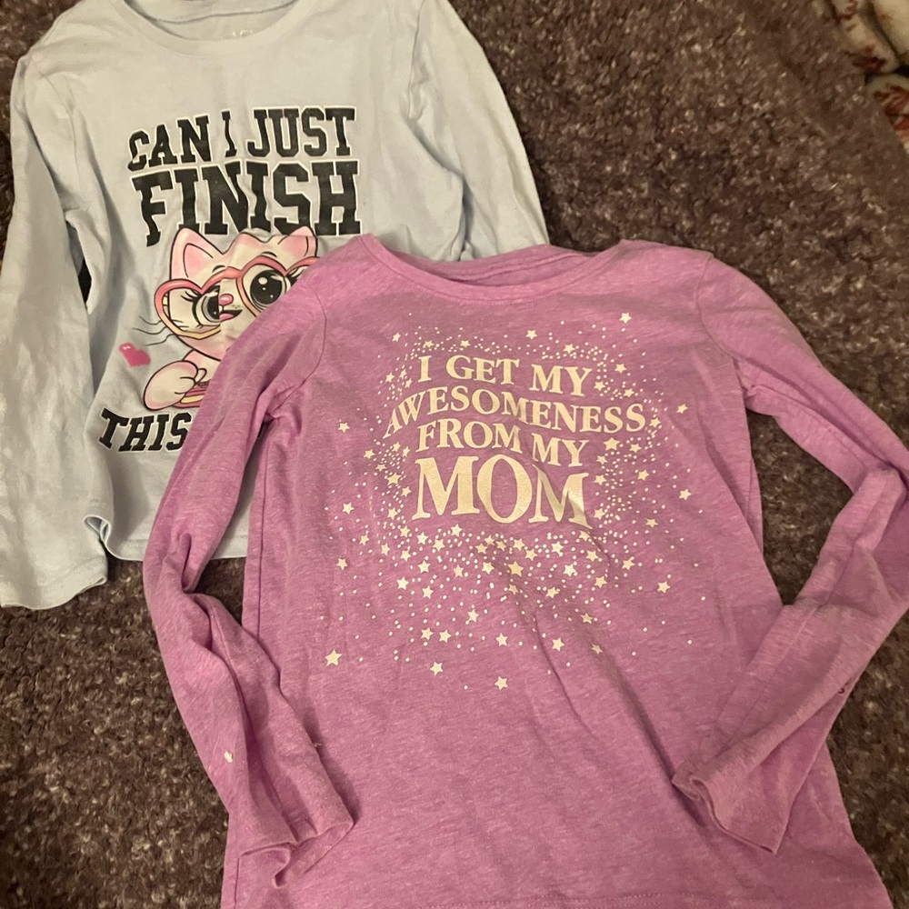 Two pairs of slightly worn size 5/6 long sleeve shirts.